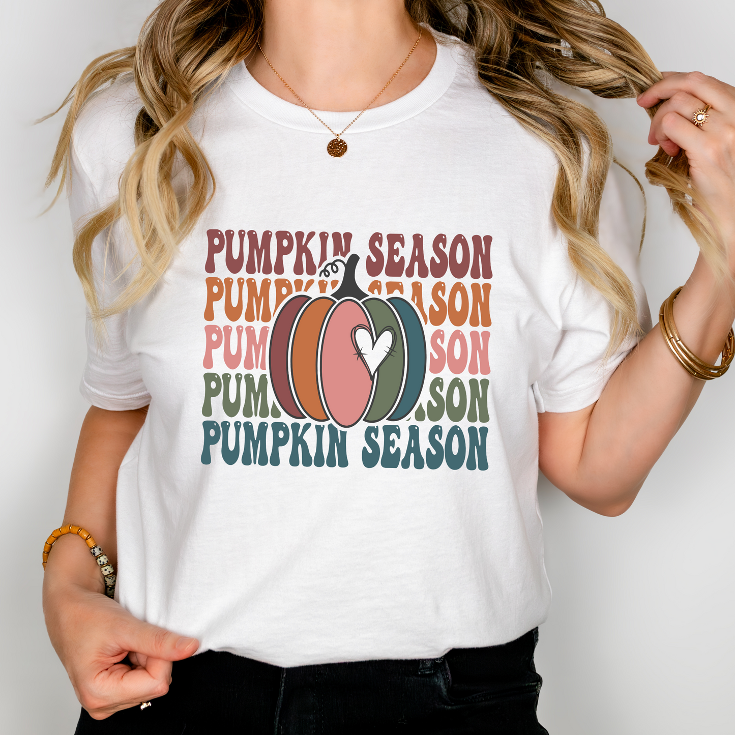 Pumpkin Season T-Shirt with colorful pumpkin and retro fall-themed text on Women’s Next Level white fitted tee, perfect for autumn lovers.