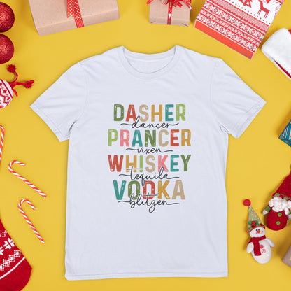 Flat lay of white holiday t-shirt featuring festive reindeer names mixed with drinks like whiskey, tequila, and vodka, on a yellow background.