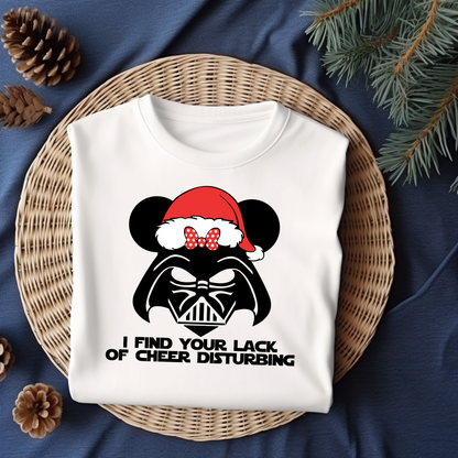 Flat lay of a white t-shirt featuring a Darth Vader-inspired design with mouse ears and a Santa hat, paired with the phrase "I Find Your Lack of Cheer Disturbing."