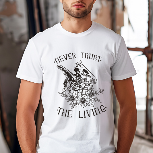 Man wearing a white t-shirt with bold black skeleton-themed graphics and the spooky phrase "Never Trust the Living," styled in casual wear.