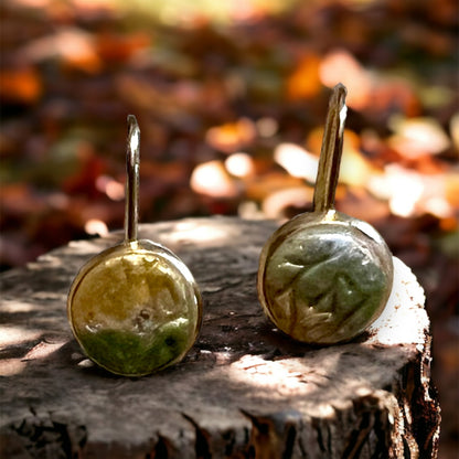 Nature-inspired dangle earrings in earthy beige and olive green tones, with handcrafted texture reflecting autumn elegance. 