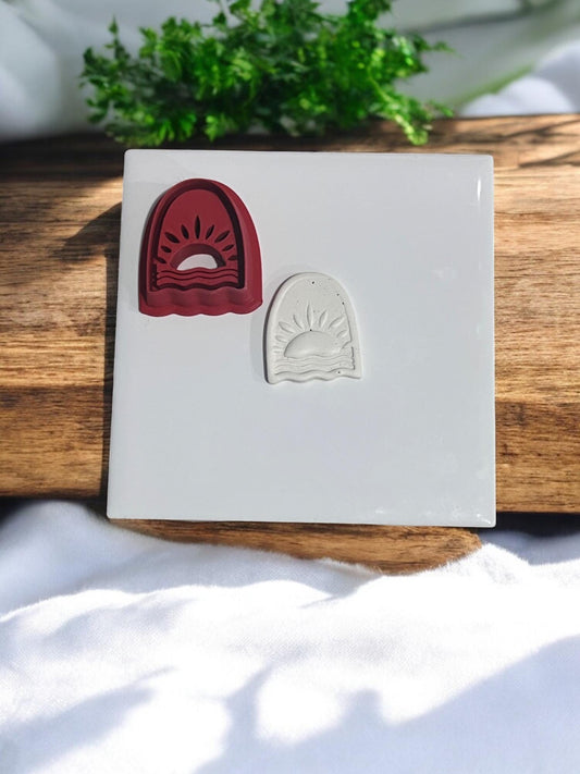 Red sunrise clay cutter shown beside finished clay shape