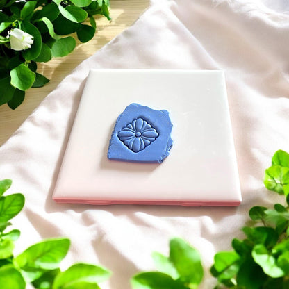 floral diamond impression in blue polymer clay