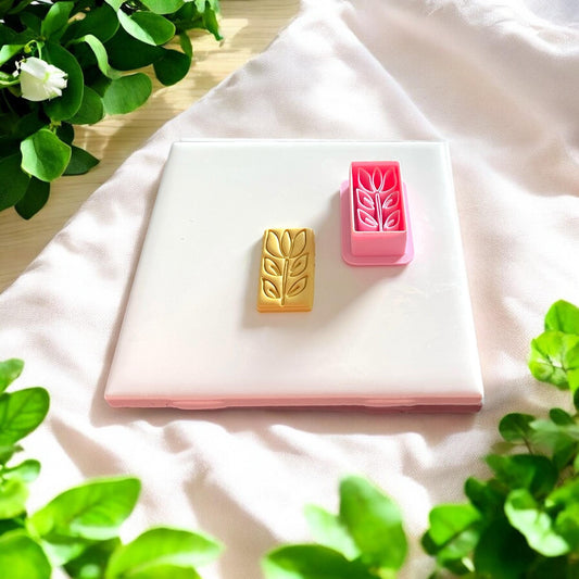 tulip clay shape next to pink rectangle cutter