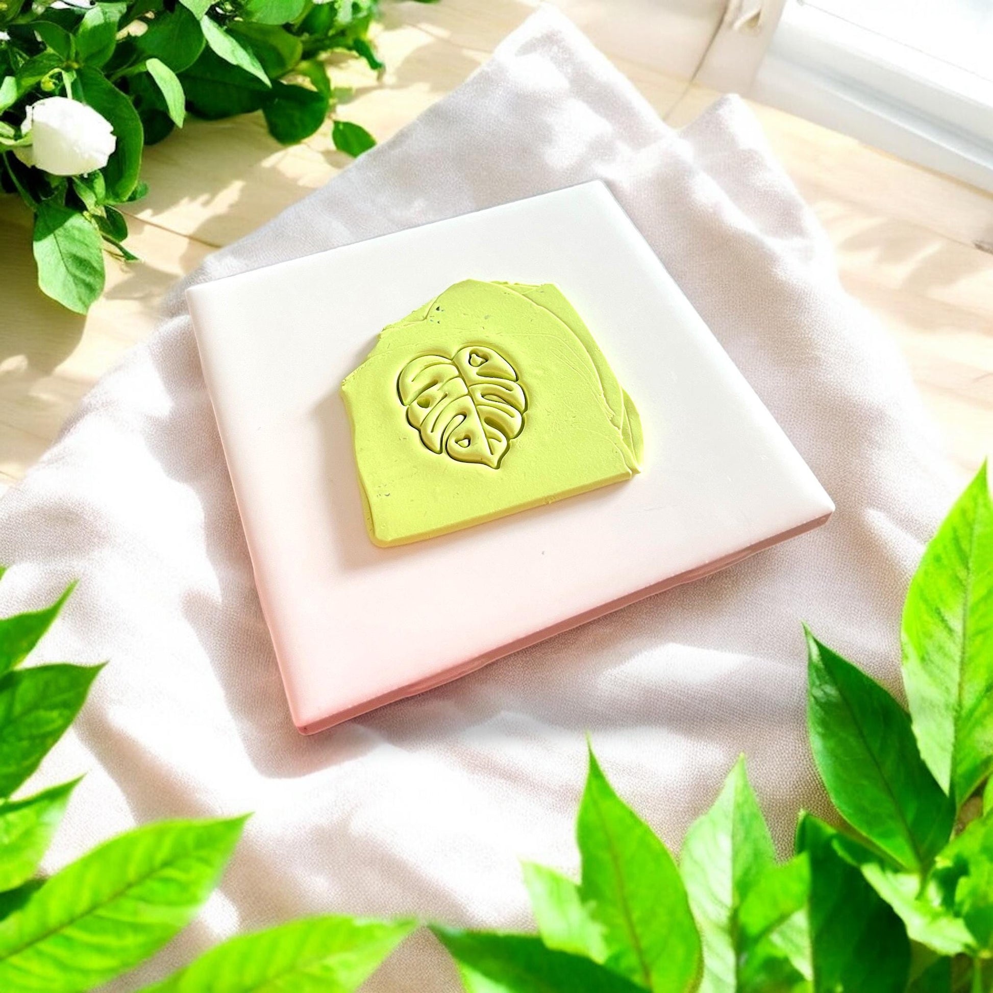 lime green clay slab with tropical leaf imprint