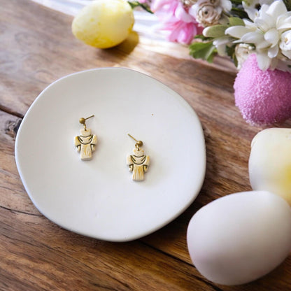 finished cross earrings on plate