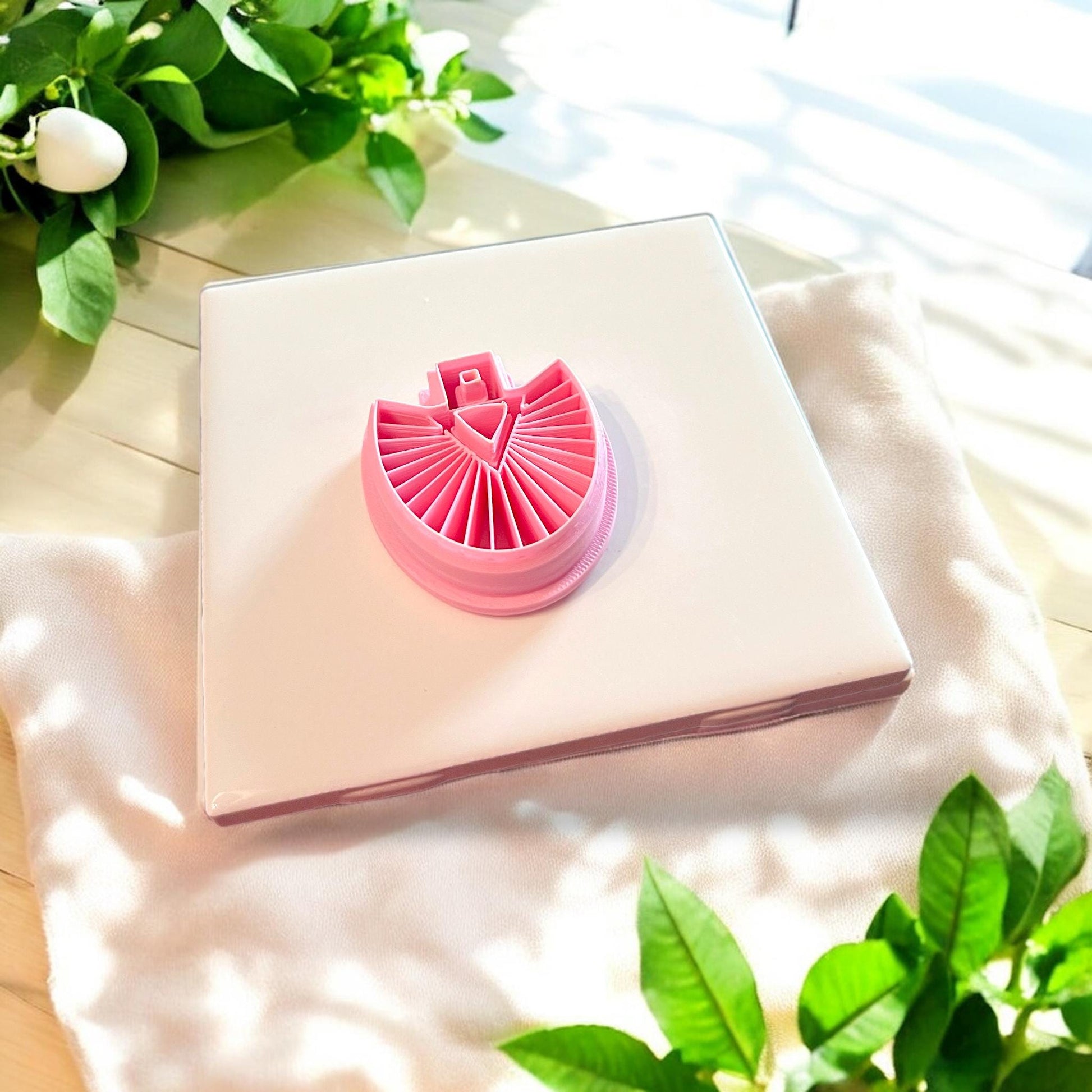 Fan shape next to pink cutters
