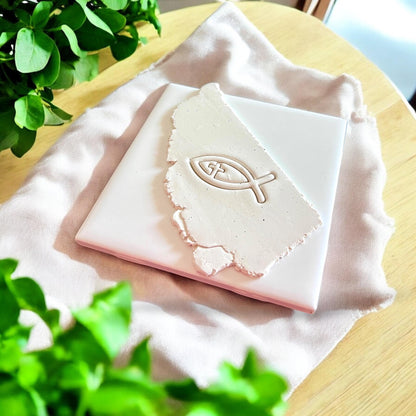 christian fish clay imprint on slab