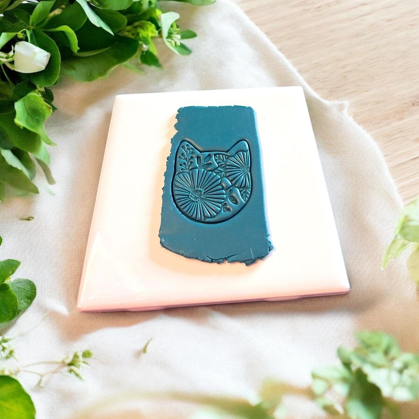 Floral Kitty pressed on clay
