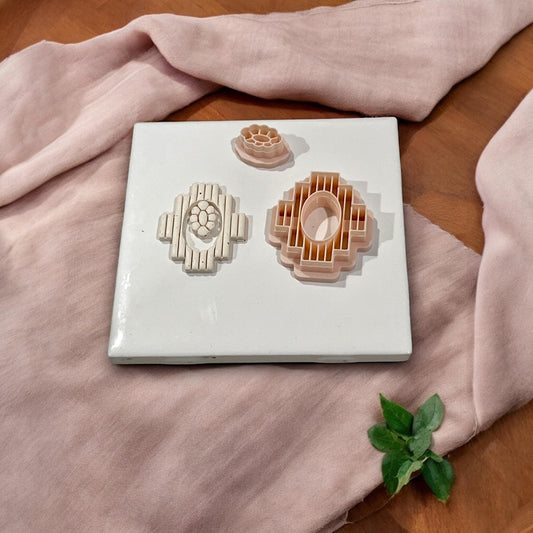 Multi-piece southwest polymer clay cutter set on tile