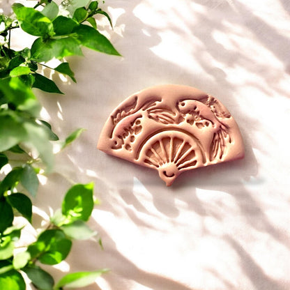 Finished koi fish fan polymer clay piece, detailed and intricate with koi and fan motif