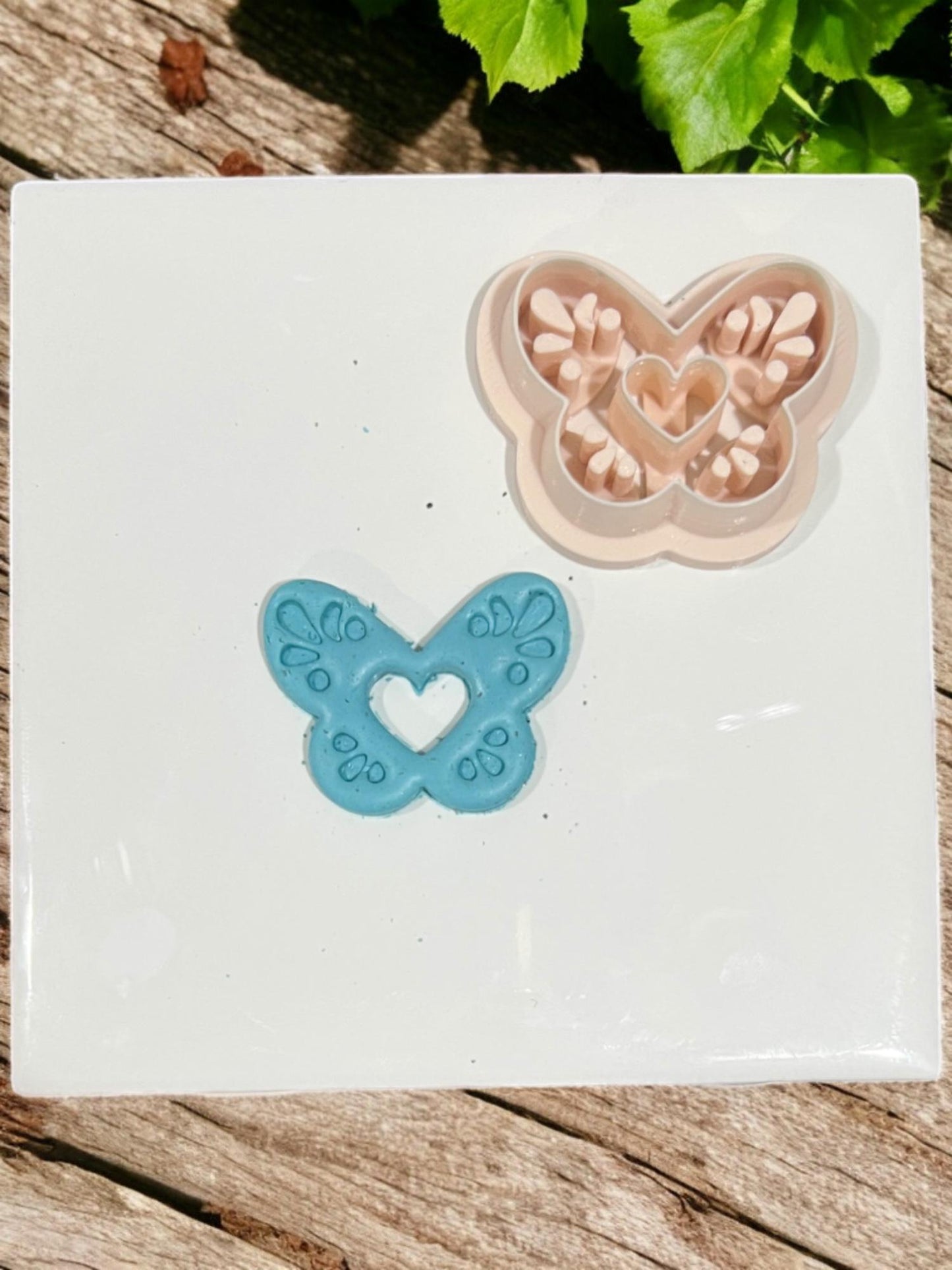 Clay butterfly next to the matching beige cutter
