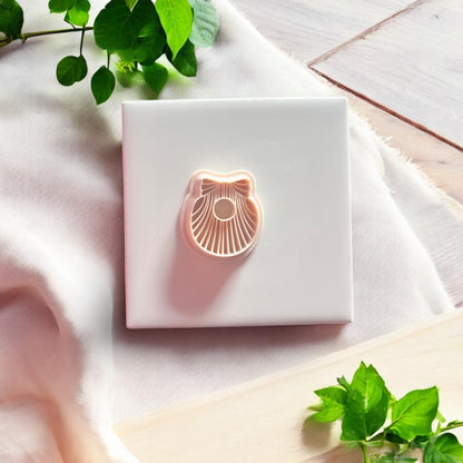 clay shell bow cutter