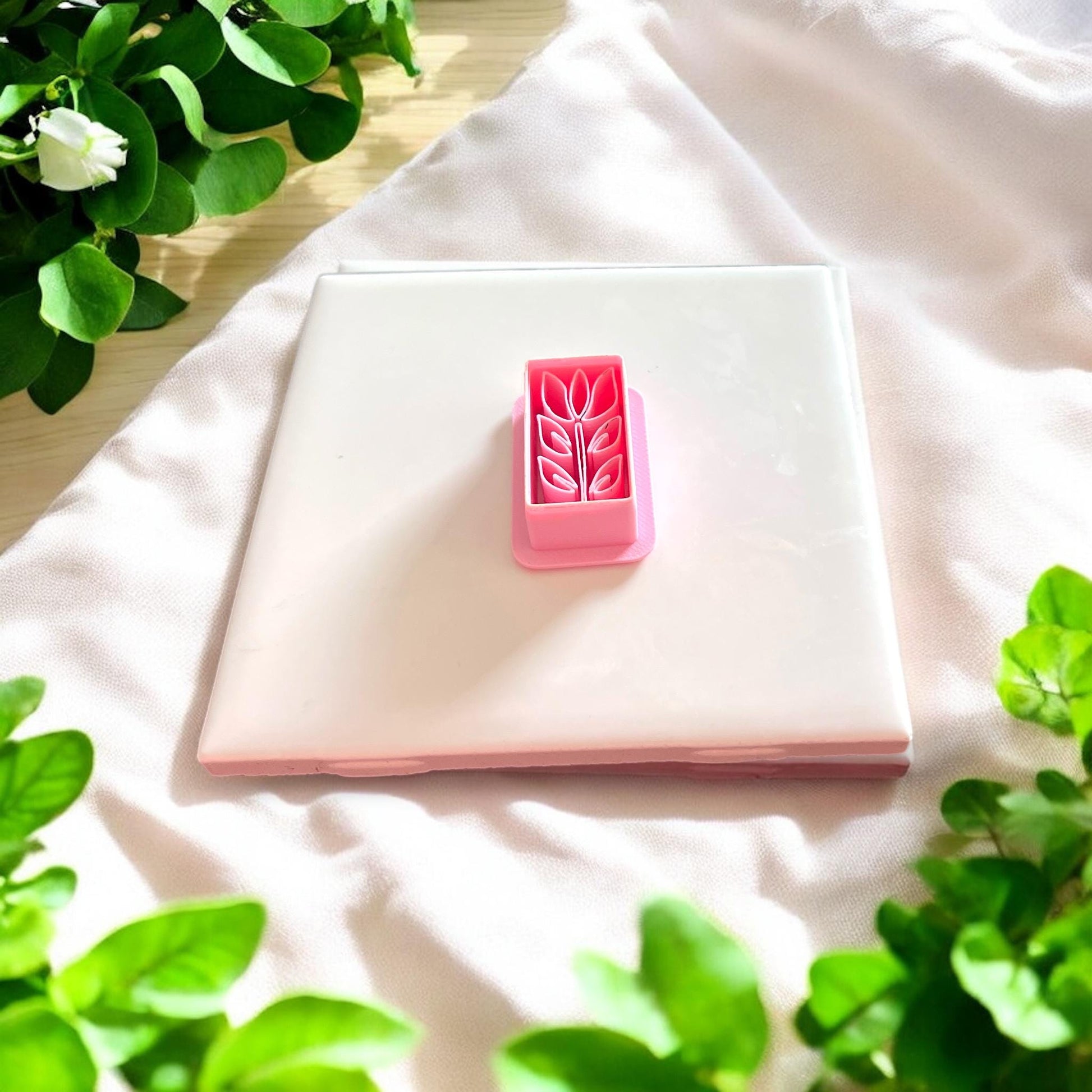 pink tulip rectangle clay cutter on white tile