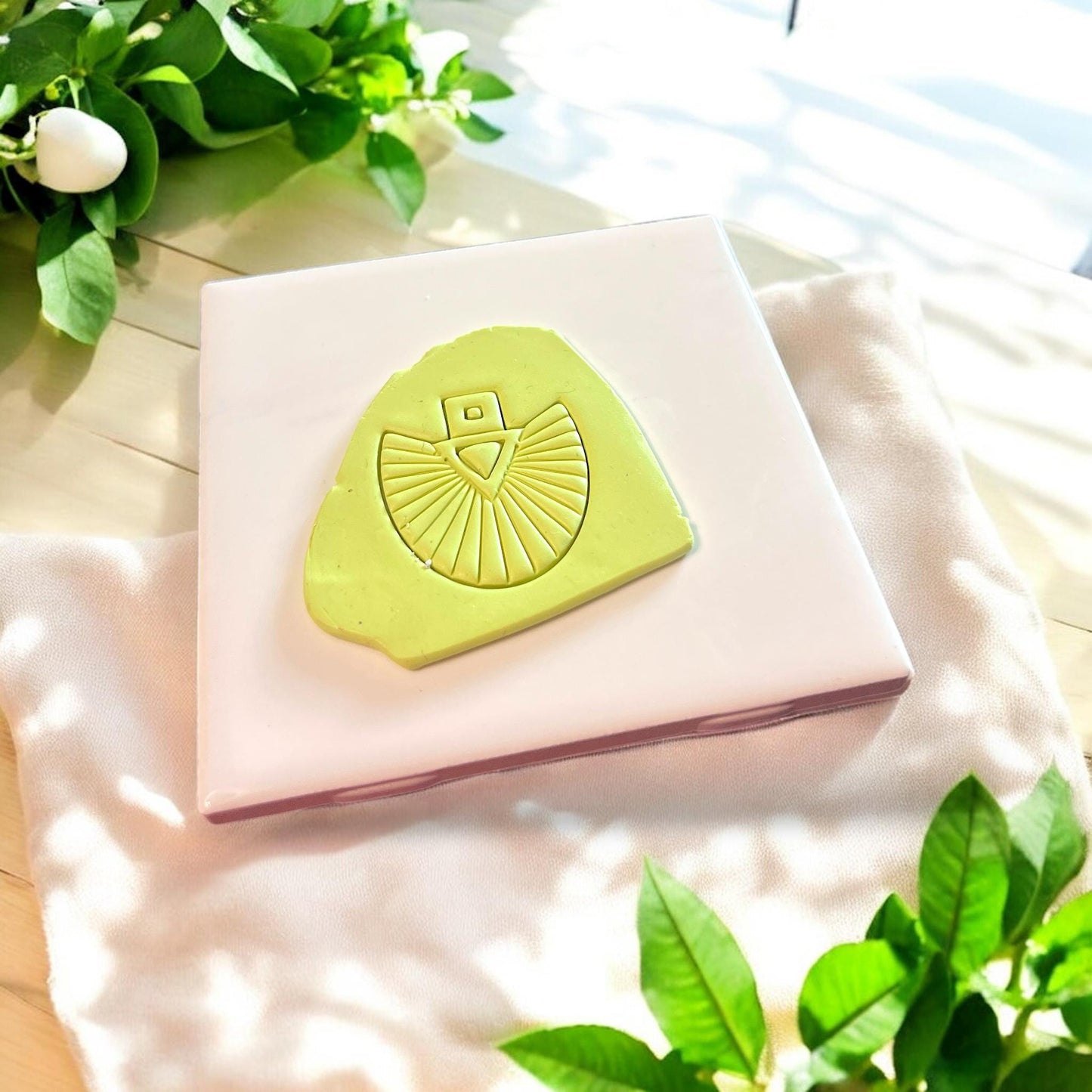 Clay slab with sunburst fan cutter