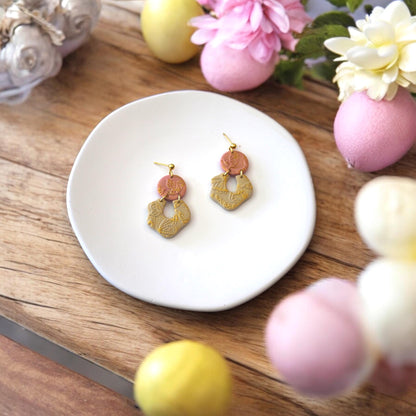 finished clay earrings on plate