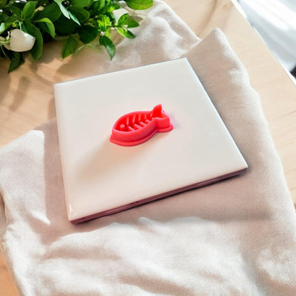 fishbone cutter on white tile