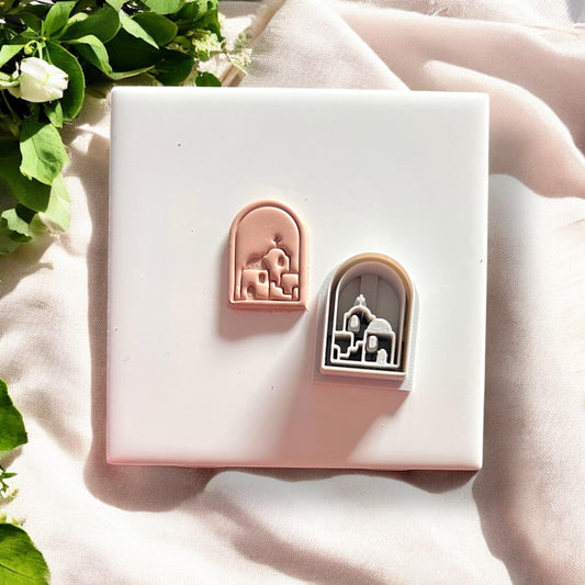 Side-by-side comparison of finished clay piece and matching white cutter with Santorini design.
