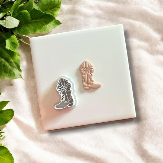 Cowboy boot cutter placed on a slab of polymer clay, ready for crafting.