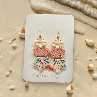 Handmade earrings created from polymer clay using the bikini top and bottom cutters, beach theme.
