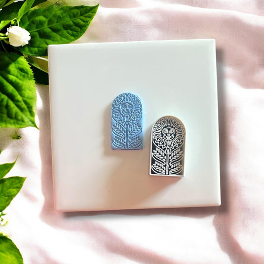 Boho-inspired sunflower arch cutout from polymer clay, showcasing intricate floral details.