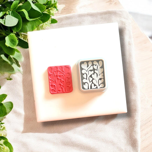 side-by-side heart clay piece and matching cutter