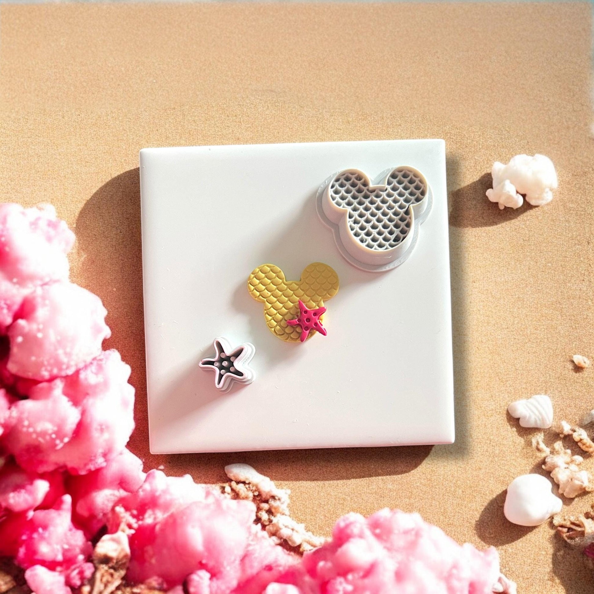 beach-themed mouse cutter and starfish cutter shown together