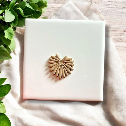 Clay palm leaf cutout after using cutter, perfect for summer statement earrings