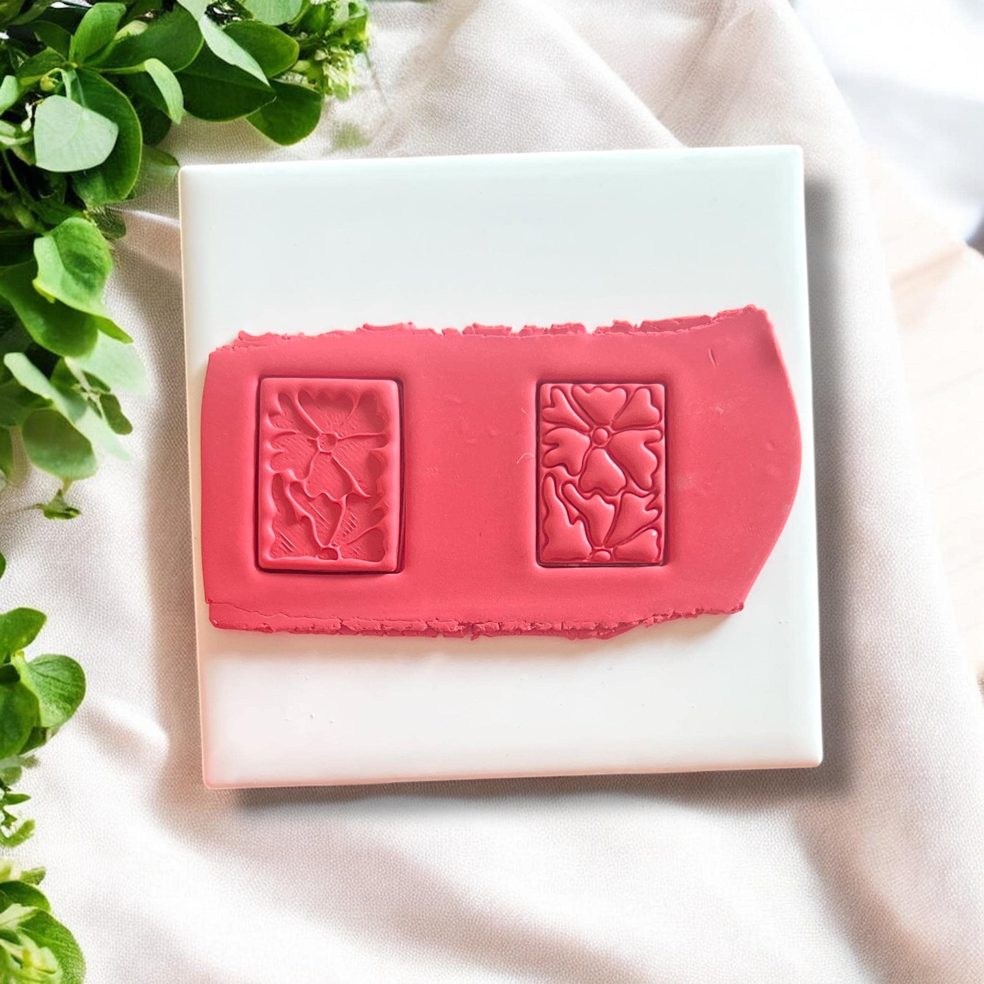 Polymer clay cutter featuring a Matisse-inspired abstract flower design, ideal for creating dangle earrings.