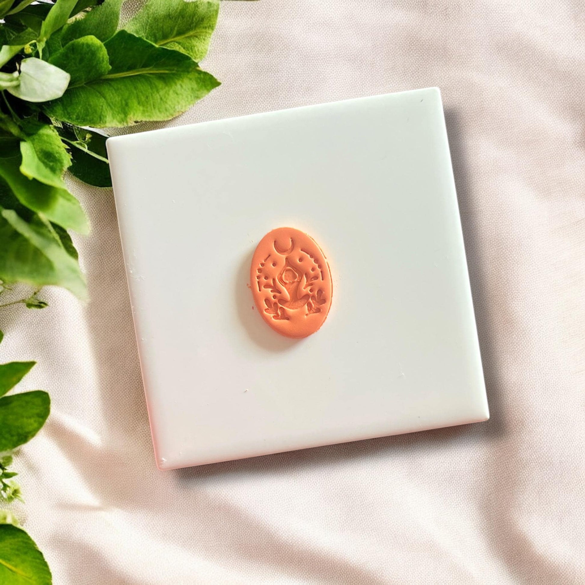 Side profile of the yoga pose cutter showcasing its detailed design for earrings.