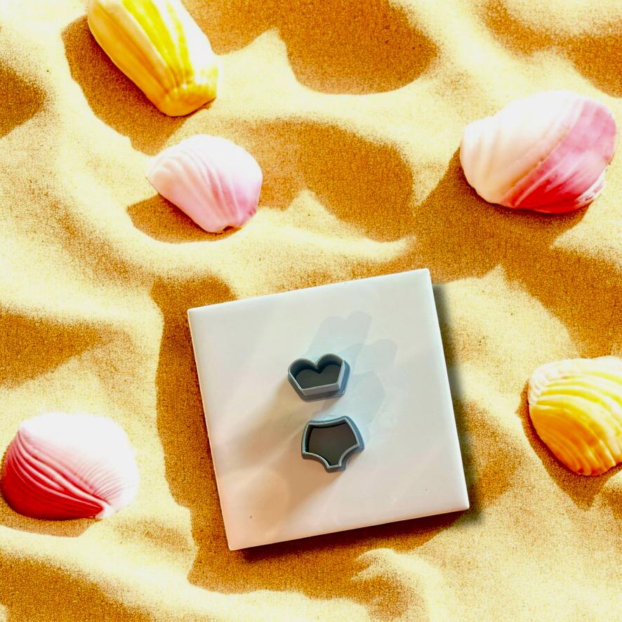 Set of clay cutters in the shape of a bikini top and bottom, ideal for jewelry making and summer crafts.