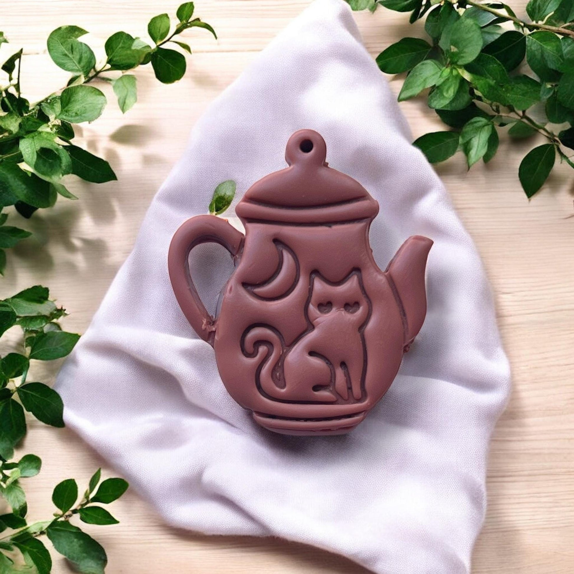 finished clay charm of teapot with cat and crescent moon