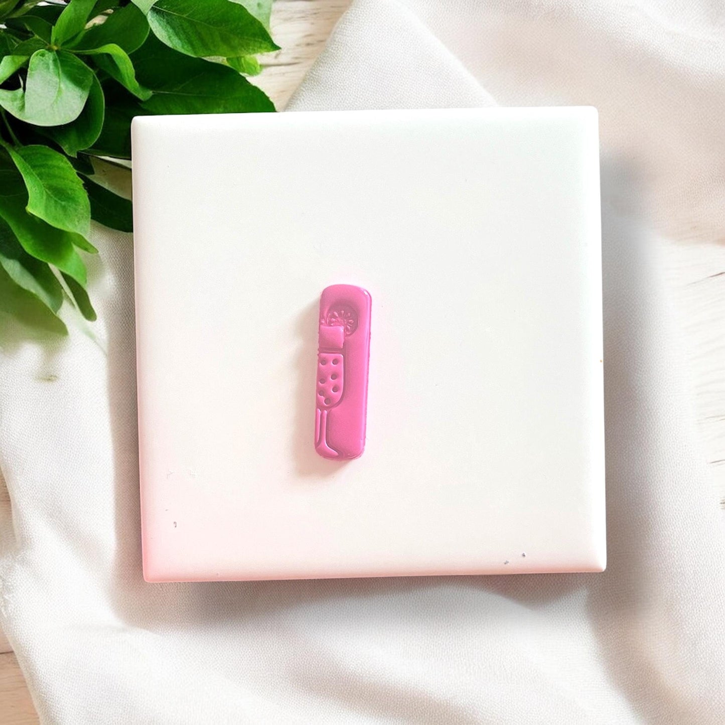 Finished mimosa clay piece with citrus detail and bubbles