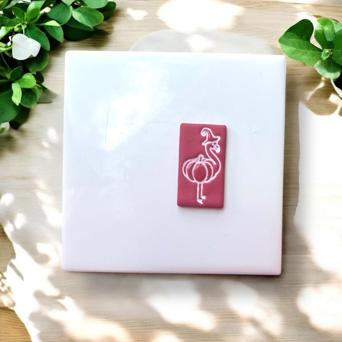 white tile with finished clay piece