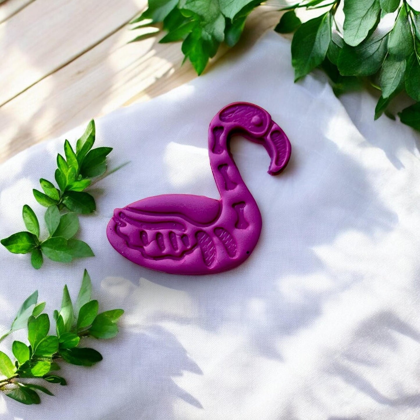 spooky cute flamingo earring impression close-up