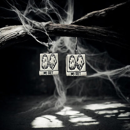 Finished No Feet ghost earrings hanging from spooky branch