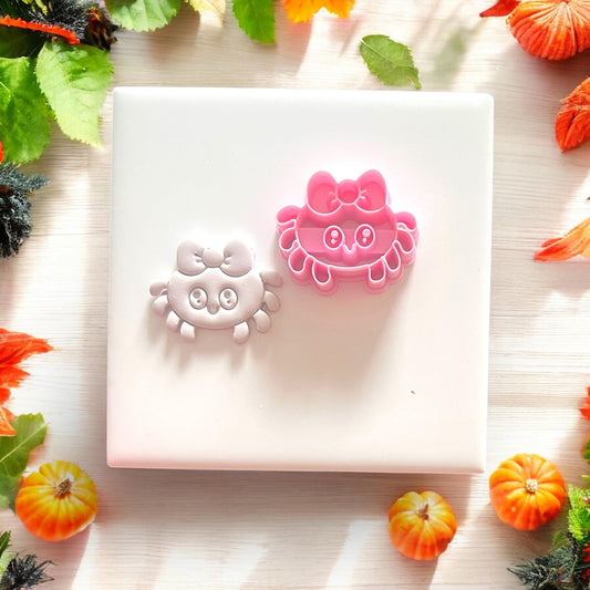 Side-by-side view of pink cutter and clay spider