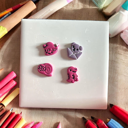 painted pink school animal clay set
