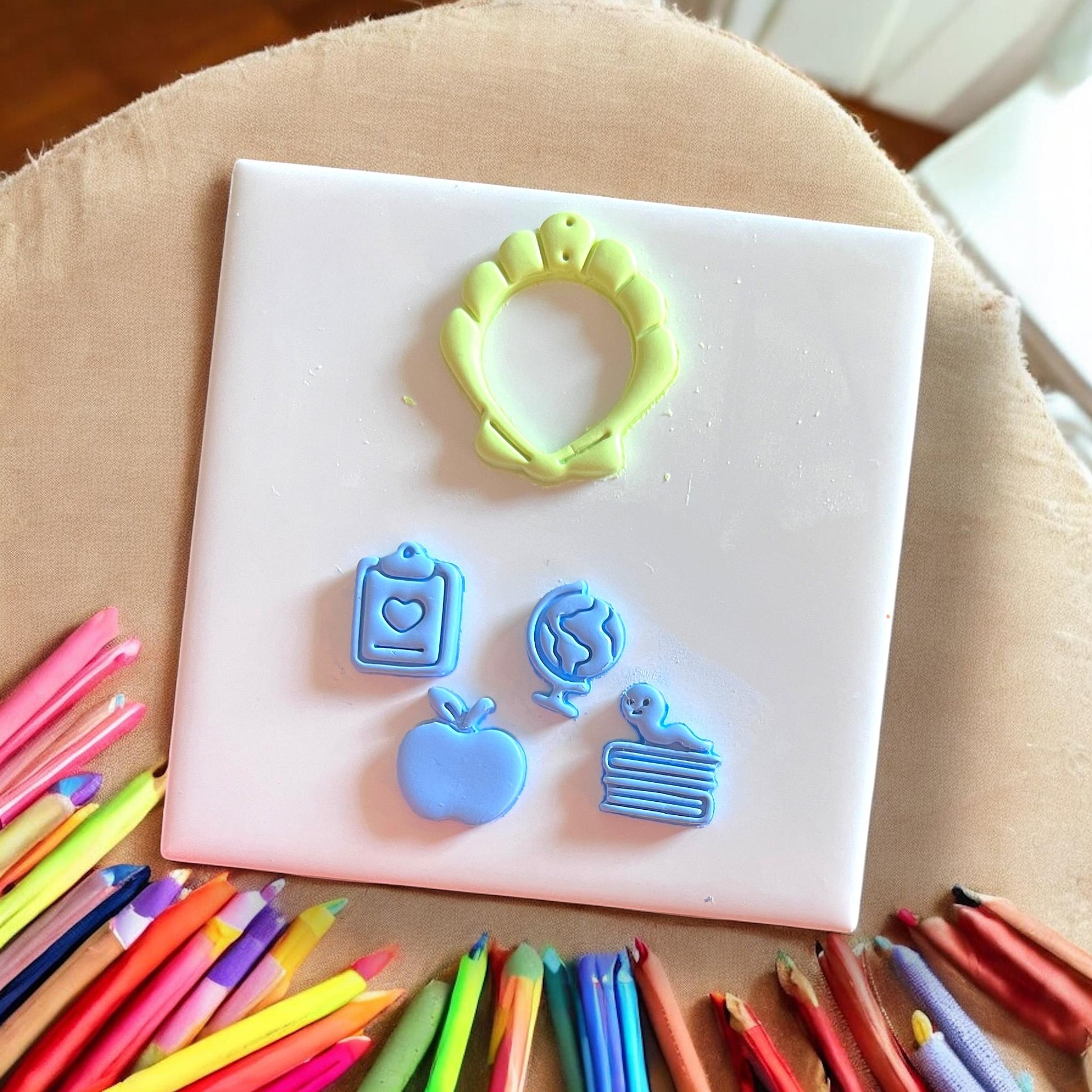 Seashell cutter with pencil and apple