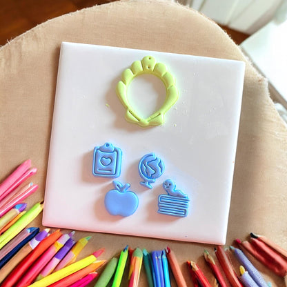 Seashell cutter with pencil and apple