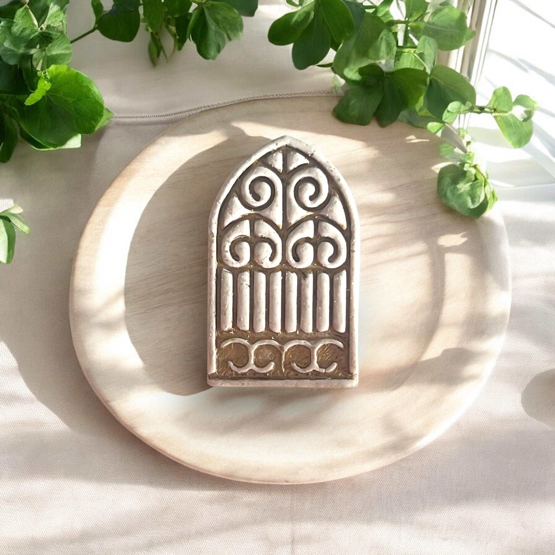 large gothic arch clay piece on plate