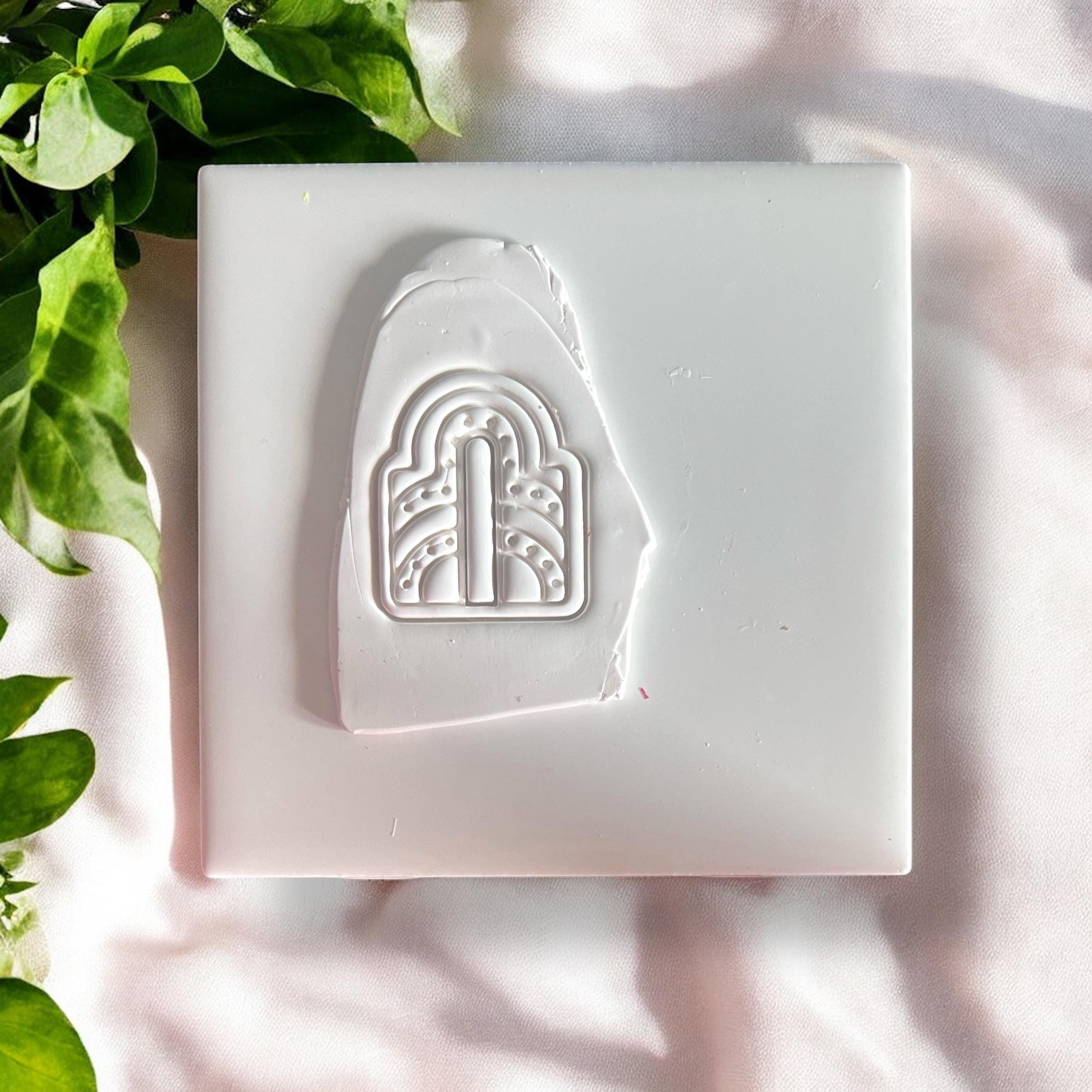 Clay impression of art deco arch shape