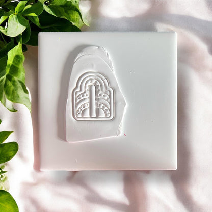 Clay impression of art deco arch shape