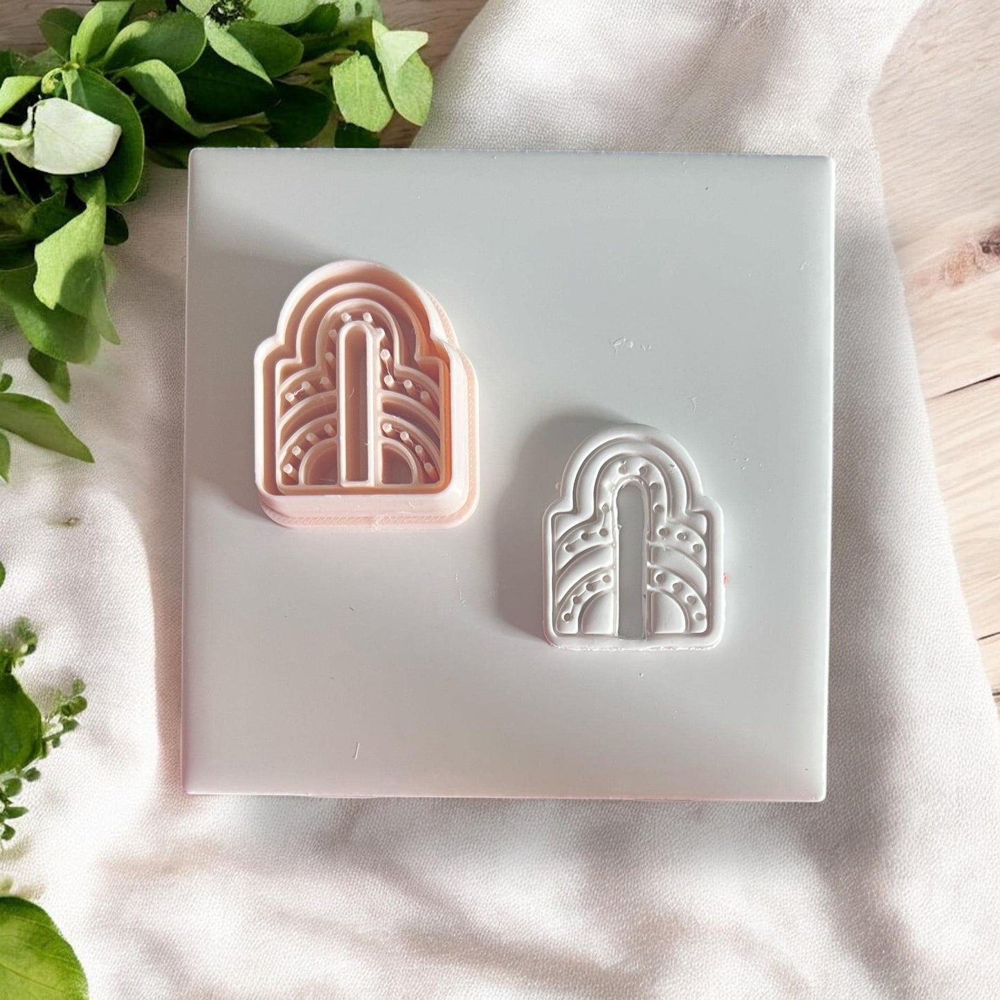 Cutter and matching clay imprint side by side