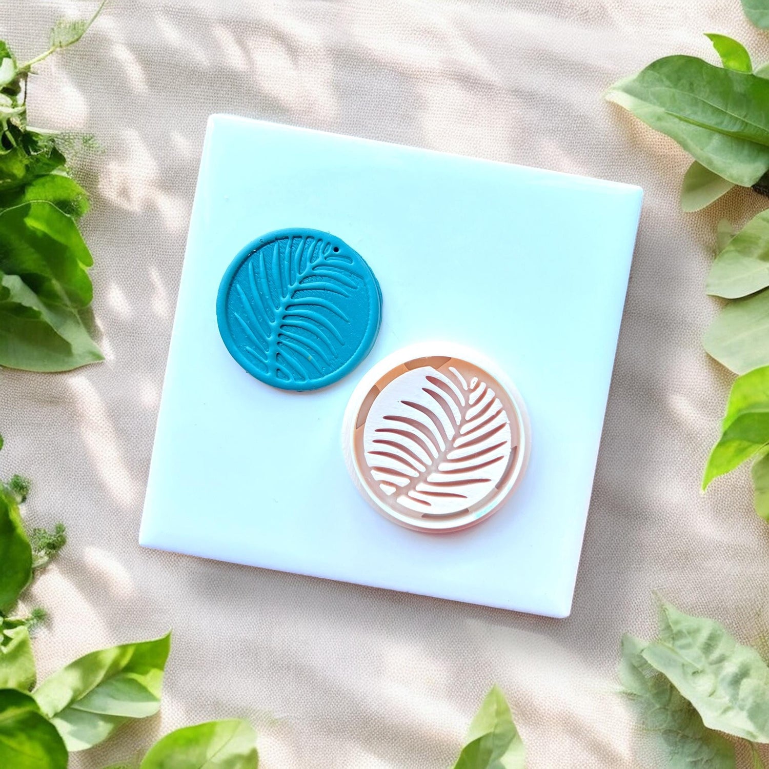 palm leaf cutter next to matching clay