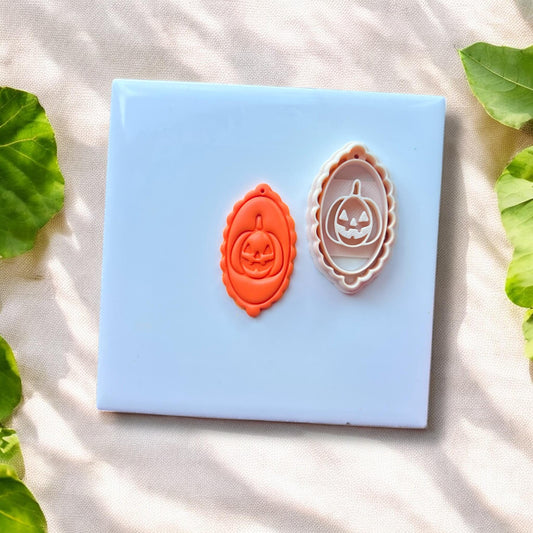 pumpkin cameo clay charm next to matching cutter