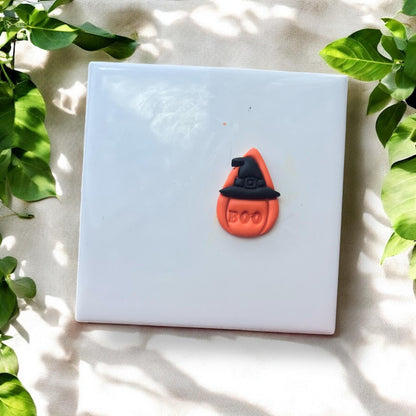 Finished pumpkin teardrop clay piece with witch hat