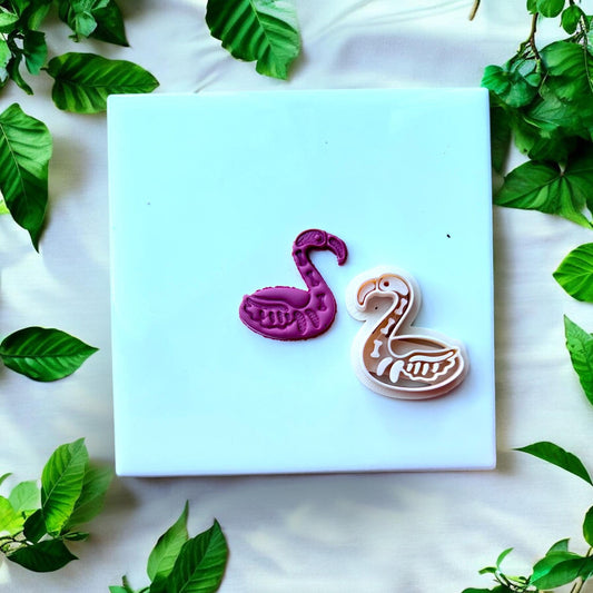 flamingo skeleton clay earring and cutter side by side