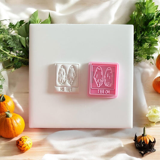 Ghost earring shape next to pink outline cutter