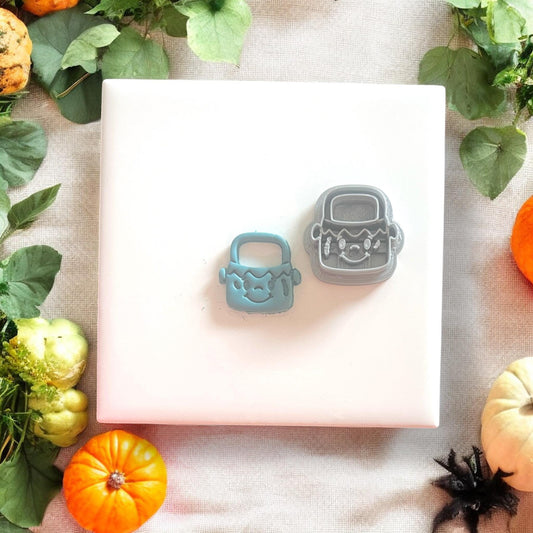 Side-by-side view of cutter and blue clay shape